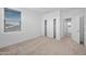Bedroom features plush carpeting, natural lighting, and a double door closet at 223451 S 228Th St, Queen Creek, AZ 85142