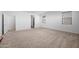 Bedroom showcasing a window with blinds, an open door, and plush carpeting at 23451 S 228Th St, Queen Creek, AZ 85142