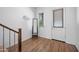 Bright entryway with hardwood floors, leading to a staircase and an exterior door at 23451 S 228Th St, Queen Creek, AZ 85142