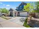 Charming two-story home with a spacious driveway and a well-maintained front yard at 23451 S 228Th St, Queen Creek, AZ 85142