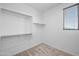 Walk-in closet with wire shelving and a window offering natural light at 23451 S 228Th St, Queen Creek, AZ 85142