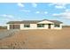 Charming single-story home with a two-car garage, desert landscaping, and a neutral color palette at 22387 S Manzanilla Rd, Buckeye, AZ 85326