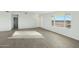 Spacious living room with lots of natural light and hard wood floors at 22387 S Manzanilla Rd, Buckeye, AZ 85326