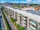 Aerial view of modern apartment building with balconies, offering a glimpse of urban living and mountain views at 2300 E Campbell Ave # 104, Phoenix, AZ 85016