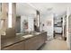 Modern bathroom featuring double sinks, a large mirror, and access to a spacious walk-in closet at 2300 E Campbell Ave # 104, Phoenix, AZ 85016