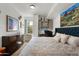 A cozy bedroom features a comfortable bed, dresser, and decorative wall art at 2300 E Campbell Ave # 104, Phoenix, AZ 85016