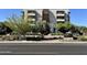 Modern apartment building with balconies and mature landscaping, offering stylish urban living at 2300 E Campbell Ave # 104, Phoenix, AZ 85016