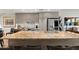 Well-equipped kitchen with stainless steel appliances, a large island with sink, and modern cabinetry at 2300 E Campbell Ave # 104, Phoenix, AZ 85016