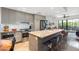 Bright, modern kitchen features stainless steel appliances and a large island with bar seating at 2300 E Campbell Ave # 104, Phoenix, AZ 85016