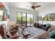Comfortable seating area with a sliding glass door to an outdoor patio with a dining set at 2300 E Campbell Ave # 104, Phoenix, AZ 85016