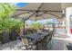 Relaxing outdoor patio featuring a dining set, comfortable seating, and shade for entertaining at 2300 E Campbell Ave # 104, Phoenix, AZ 85016