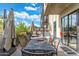Inviting patio with a dining set, comfortable lounge seating, and an umbrella for shade, ideal for relaxation at 2300 E Campbell Ave # 104, Phoenix, AZ 85016