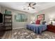 Cozy bedroom with plush rug, a comfortable bed, and lots of natural light at 233 W Sweet Shrub Ave, San Tan Valley, AZ 85140