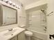 This bathroom offers a single sink vanity, a large mirror, and a shower-tub combo at 2333 E Southern Ave # 1101, Tempe, AZ 85282