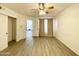 Spacious bedroom featuring light colored walls, ceiling fan and wood-look flooring at 2333 E Southern Ave # 1101, Tempe, AZ 85282