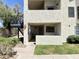 Exterior view of a multi-level home featuring stucco walls, a stairwell and lush landscaping at 2333 E Southern Ave # 1101, Tempe, AZ 85282