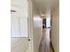 Hallway features tile floors, laundry closet, and access to the bedrooms and living area at 2333 E Southern Ave # 1101, Tempe, AZ 85282