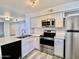 Modern kitchen featuring stainless steel appliances, white cabinetry and ample counter space at 2333 E Southern Ave # 1101, Tempe, AZ 85282