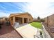Expansive backyard featuring manicured lawn and patio, perfect for outdoor living and entertaining at 23814 W Chambers W St, Buckeye, AZ 85326