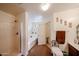 Bright bathroom featuring a shower, tub, and vanity, providing a comfortable space for relaxation and convenience at 23814 W Chambers W St, Buckeye, AZ 85326