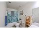 Cozy bathroom with a shower-tub combo and a natural wood storage rack at 23814 W Chambers W St, Buckeye, AZ 85326