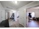 Bright hallway with clean, white walls, and doorways leading to the office and other rooms at 23814 W Chambers W St, Buckeye, AZ 85326