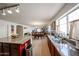 Open concept kitchen with island and stainless steel appliances leading to dining and living areas at 23814 W Chambers W St, Buckeye, AZ 85326