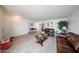 Spacious living room featuring light wood floors, neutral walls, and comfortable seating arrangements at 23814 W Chambers W St, Buckeye, AZ 85326