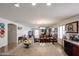 Open concept living space with dining area and modern kitchen island at 23814 W Chambers W St, Buckeye, AZ 85326
