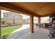 Covered patio with a view of the backyard and neighborhood, perfect for outdoor living and entertaining at 23814 W Chambers W St, Buckeye, AZ 85326