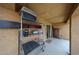 Covered outdoor patio featuring shelving with storage, perfect for outdoor relaxation and storage at 23814 W Chambers W St, Buckeye, AZ 85326