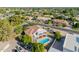 A charming two-story home boasts a sparkling pool and well-maintained landscaping at 2438 N Forest Cir, Mesa, AZ 85203