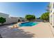 Backyard pool and gazebo surrounded by grass, mature trees, and privacy walls at 2438 N Forest Cir, Mesa, AZ 85203