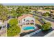 Backyard with a sparkling pool, covered patio, and lush green lawn at 2438 N Forest Cir, Mesa, AZ 85203