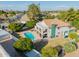Backyard with a sparkling pool, covered patio, and lush green lawn at 2438 N Forest Cir, Mesa, AZ 85203