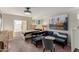 Bedroom with a bed, sofa, a large window, and minimalist decor at 2438 N Forest Cir, Mesa, AZ 85203