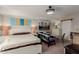 Cozy bedroom featuring neutral walls, carpet, and a decorative ceiling fan at 2438 N Forest Cir, Mesa, AZ 85203