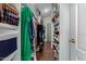 Walk-in closet with shelving and hanging storage for clothes, shoes, and accessories at 2438 N Forest Cir, Mesa, AZ 85203