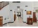 Spacious hallway with tiled floors and access to multiple rooms at 2438 N Forest Cir, Mesa, AZ 85203