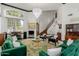 Spacious living room featuring high ceilings, a fireplace, and ample seating at 2438 N Forest Cir, Mesa, AZ 85203