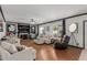 Spacious living room with hardwood floors, fireplace, and comfortable seating arrangement at 2438 N Forest Cir, Mesa, AZ 85203