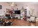 Large home office featuring hardwood floors, decor shelving, and a desk workspace at 2438 N Forest Cir, Mesa, AZ 85203
