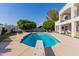 Backyard pool featuring a diving board, surrounded by mature trees and a gazebo at 2438 N Forest Cir, Mesa, AZ 85203