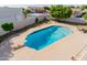 A backyard pool with a diving board, surrounded by grass, a white gazebo, and mature trees at 2438 N Forest Cir, Mesa, AZ 85203