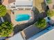 Aerial view of a backyard swimming pool with patio and seating areas at 2438 N Forest Cir, Mesa, AZ 85203