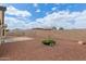 Backyard with gravel, patio area, and garden at 25212 W Maldonado Dr, Buckeye, AZ 85326