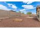 Fenced backyard with gravel landscaping and fire pit feature at 25212 W Maldonado Dr, Buckeye, AZ 85326