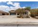 Charming single-story home with desert landscaping, a two-car garage, and a welcoming facade under a partly cloudy sky at 25212 W Maldonado Dr, Buckeye, AZ 85326