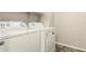 Bright laundry room with white washer and dryer units at 25212 W Maldonado Dr, Buckeye, AZ 85326
