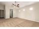 Neutral carpet, ceiling fan, and en suite bathroom are all found in this spacious main bedroom at 25212 W Maldonado Dr, Buckeye, AZ 85326